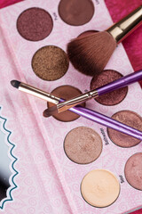 palette of eyeshadow and make up brushes