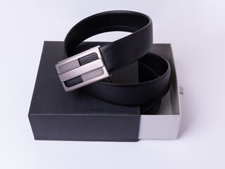 Men's belt made of genuine black leather with a metal buckle. Packed in a gift box