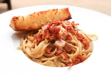 spaghetti or spaghetti carbonara with bread