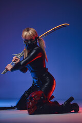 Futuristic woman in tight clothes with sword