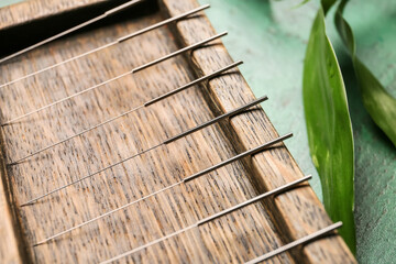 Acupuncture needles on wooden board, closeup