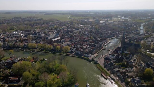 Weesp small city in North holland, The Netherlands, city view along the water aerial drone footage.