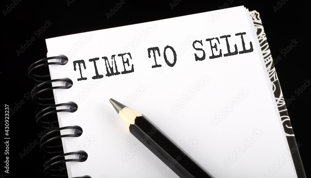Poster time to sell written text in small notebook on a black background