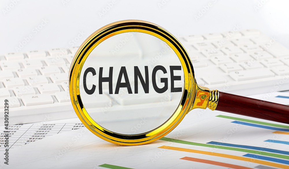 Poster magnifying glass with the word change on the chart background