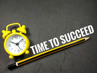 Business concept.Word TIME TO SUCCEED with clock and pencil on black background.