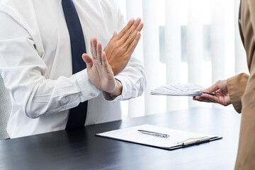 Businessman partner hand gesture rejecting refusing money, anticorruption concept.