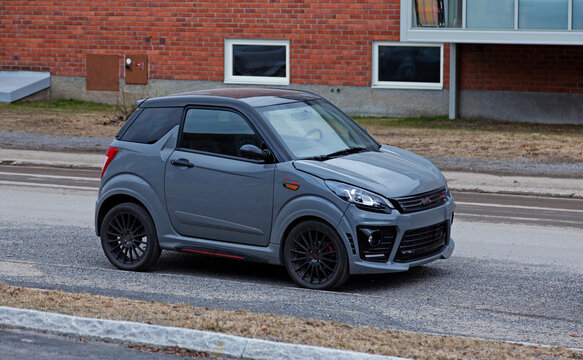Umea, Norrland Sweden - May 2, 2020: a gray moped car is parked on the street