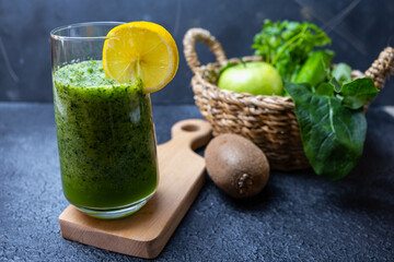 Fresh green organic vegetables. Vegan drink concept. Healthy smoothie on black background.