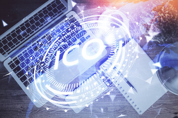 Blockchain theme hologram drawings over computer on the desktop background. Top view. Double exposure.