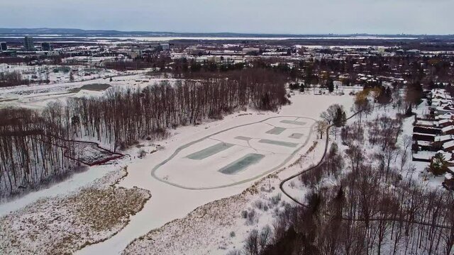 Outdoor rinks on pond in Canadian neighborhood
