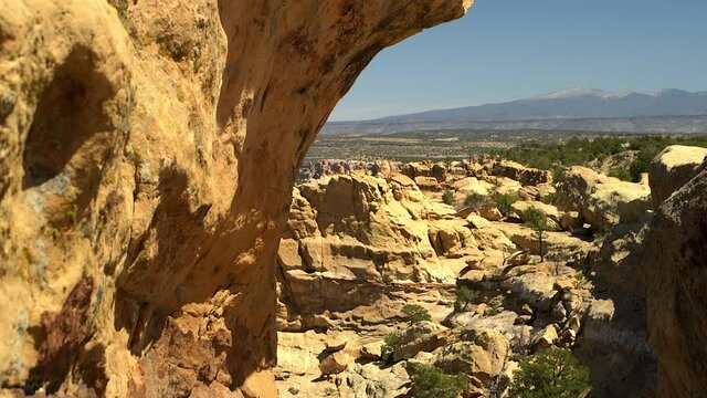 Sandstone Bluffs, El Malpais National Monument in the desert of New Mexico is a dramatic landscape made of Dakota Sandstone that contrasts with the dark lava flows farther. View of Mount Taylor.