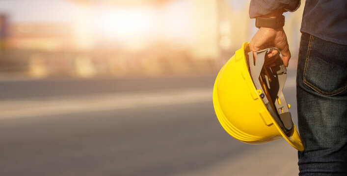 Engineer Holding Helmet On Site Road Construction For The Development Of Modern Transportation Systems, Technician Worker Hold Hard Hat Safety First