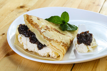 Pancake with cottage cheese and jam