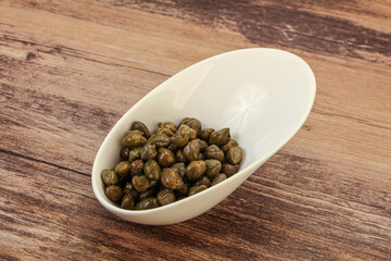 Tasty capers in the bowl