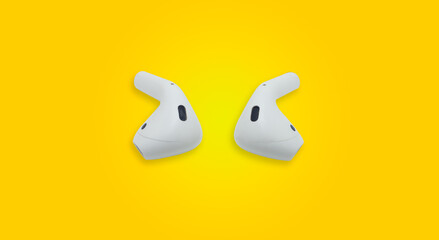 White wireless headphones With two sides placed in the center of the picture Yellow background with copy space concept, new technology, technology development