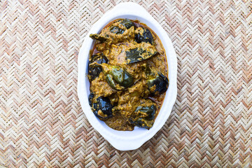 Delicious Indian brinjal curry specially made in south india known as Gutti Vankaya an Andhra party style side dish with peanut,sesame gravy. Eggplant or Aubergine stuffed masala. baingan ki sabzi