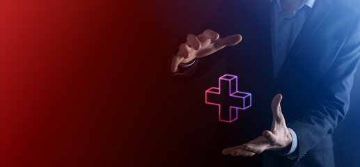 Businessman hold 3D plus icon, man hold in hand offer positive thing such as profit, benefits, development, CSR represented by plus sign.The hand shows the plus sign