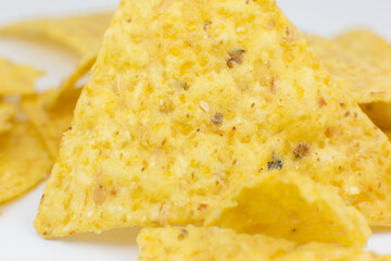 Close up, Triangular chips, mexican nachos, on white background. Perfect Tasty spicy snack for a beer.