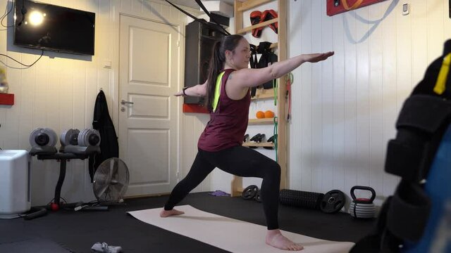 Different yoga poses performed in home gym with various gym equipment in background