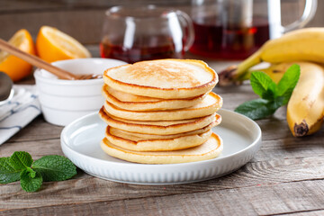 Pancakes. Stack of pancakes with honey. Tasty breakfast food on a table