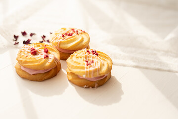 selection of sweet baked cream edible flowers and fruit dessert cakes for mothersday, wedding, birthday, paerty celebration. viola odorata cake. 