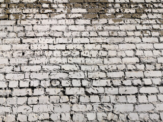 Old crumbling brick wall as an abstract