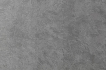 Loft style plaster wall in gray color. Plastering wall with cement colour.