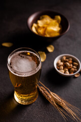 A glass of cold beer and snacks