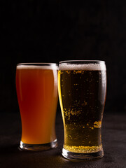 Two glasses of cold beer on the table