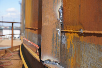 Manual arc welding. Defective butt weld of welding of metal sheets. Repair of a tank for storing oil, gasoline and gas