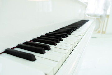 white grand piano with keys close-up. classical music