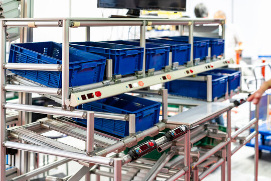 basket or plastic box container on roller rack or aluminum shelf with electronic display smart module system for management – control or operate stock such as quantity and data information etc.
