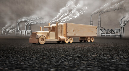Handmade truck with natural wood set in an industrial city polluted with toxic fumes. Air pollution...