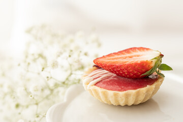 selection of sweet baked cream edible flowers and fruit dessert cakes for mothersday, wedding, birthday, paerty celebration. viola odorata cake. 