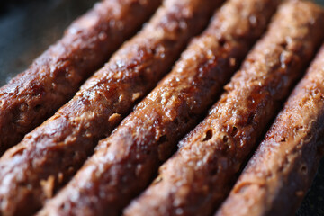Closeup of grilled meaty appetizing fried sausages