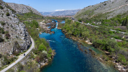 Fototapeta na wymiar Aerial drone view of river. River flowing in valley, view from above. Neretva river in Bosnia and Herzegovina.