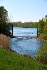 river flows into a dredging lake