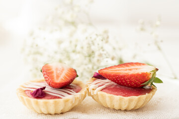 selection of sweet baked cream edible flowers and fruit dessert cakes for mothersday, wedding, birthday, paerty celebration. viola odorata cake. 