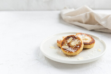 Tofu cheese pancakes on a plate. Vegan food, sugar, gluten and lactose free. Horizontal orientation, copy space.