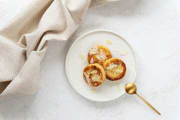 Tofu pancakes in a plate on a light table. Vegan food, sugar, gluten and lactose free. Horizontal orientation, top view.