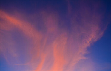 The view of the red and bright sky in the morning. Nature background. Dramatic clouds on the sky in red colors	