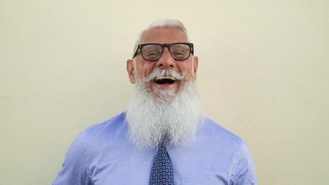 Happy senior business man having fun laughing in front camera - Fashion elderly male lifestyle concept
