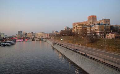 Fototapeta na wymiar Panorama of evening Moscow with view of Moscow river and Rostovskaya embankment, Moscow, Russia