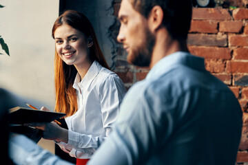 man and woman work colleagues lifestyle finance