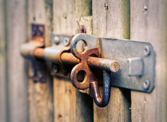 old rusty lock on wooden doors 