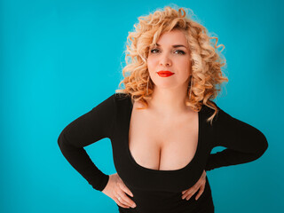 young beautiful blonde curly haired woman plus size body positive with big breasts - obrazy, fototapety, plakaty