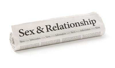 Rolled newspaper with the headline Sex and Relationship