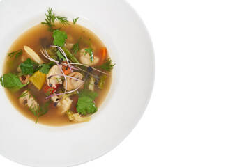 Top view close up of delicious vegetables soup in modern beautiful bowl. Concept of healthy soup with season vegetables mushrooms, potatoes, carrots, potatoes and different greens.