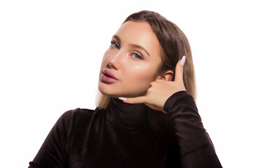 Face expression portrait of beautiful woman with blue eyes making a call me gesture isolated on white background with copy space