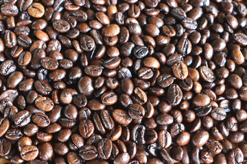 Coffee seeds pile backgrounds and textures background closeup.